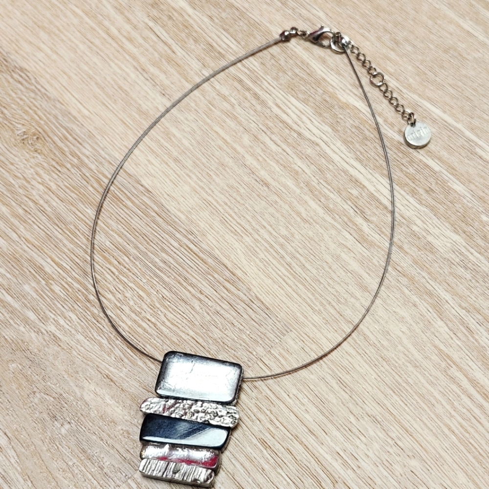 Silver and Black Necklace Origin